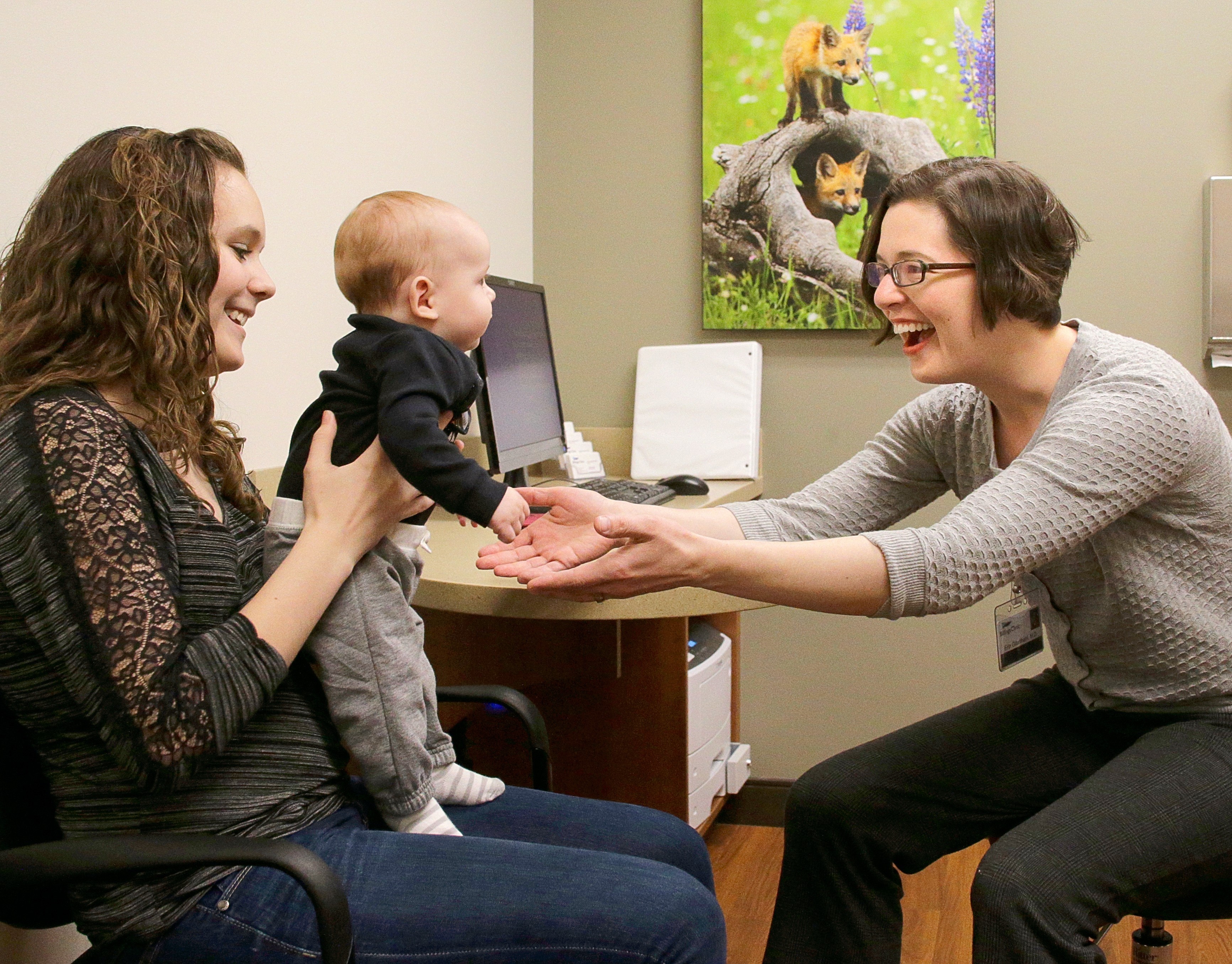 Dr. Grantham with infant and his mother